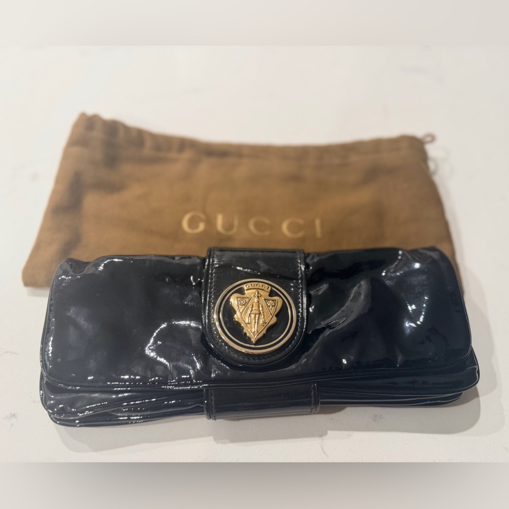 Gucci Shiny Black Leather Clutch bag with Gold Emblem